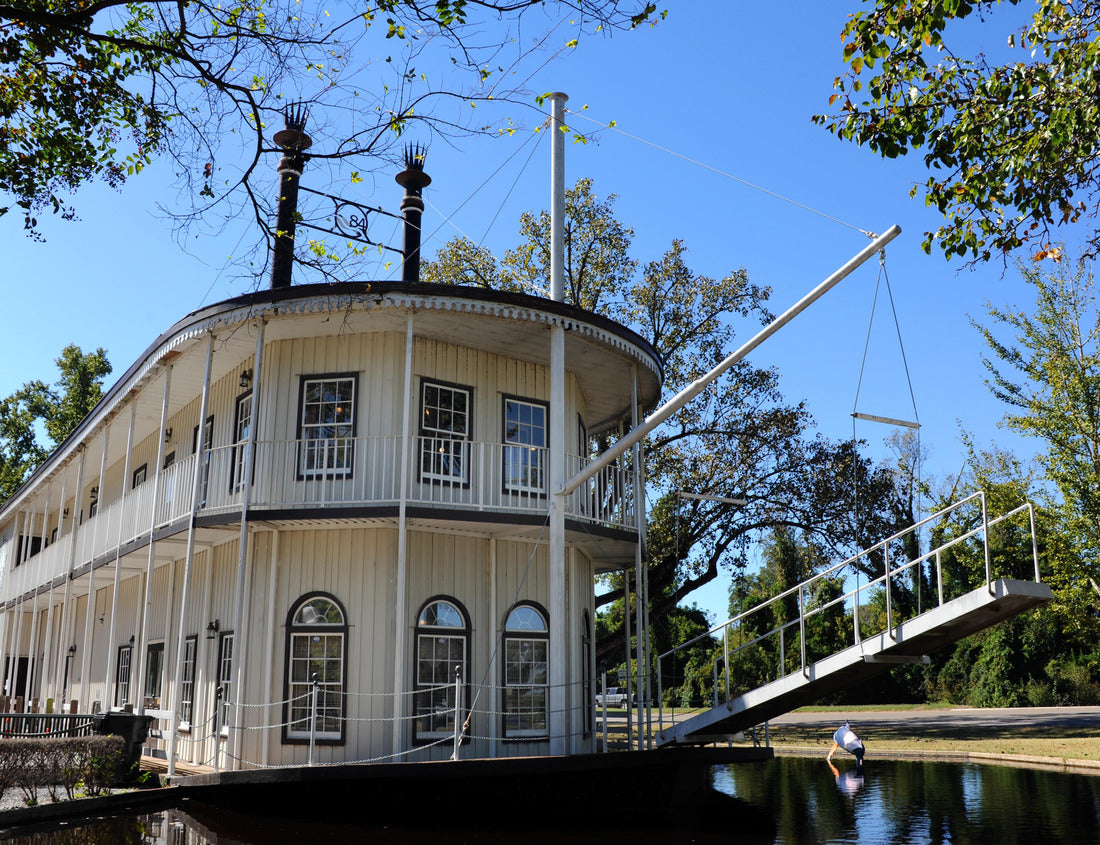 Noah Jigsaw Puzzle Double decker, paddle boat serves as a visitor's center for Greenville, Mississippi. Boat is white with black trim and floats on water 1000 pieces