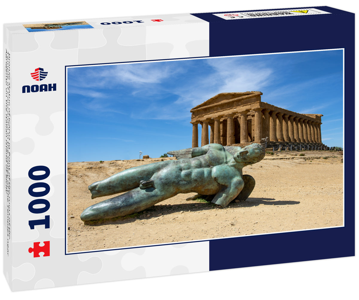 Bronze statue of Icarus in front of the ruins of the Temple of Concordia in the Valley of the Temples near Agrigento on the Italian island of Sicily