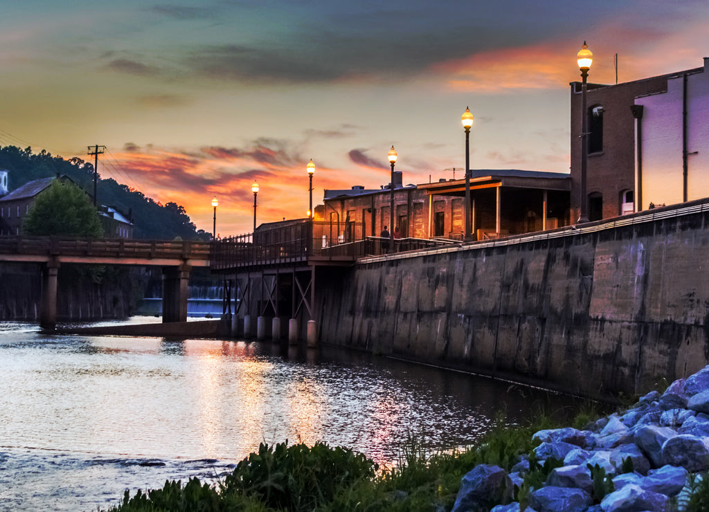 Locals enjoying an evening stroll along Autauga Creek in Prattville, Alabama