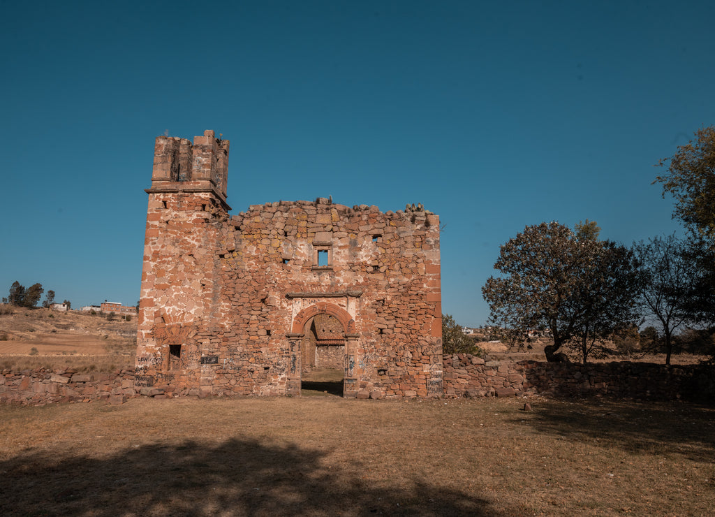 Old church in the helmet of a farm in Amealco, Queretaro, Mexico already in ruins and with the evening light