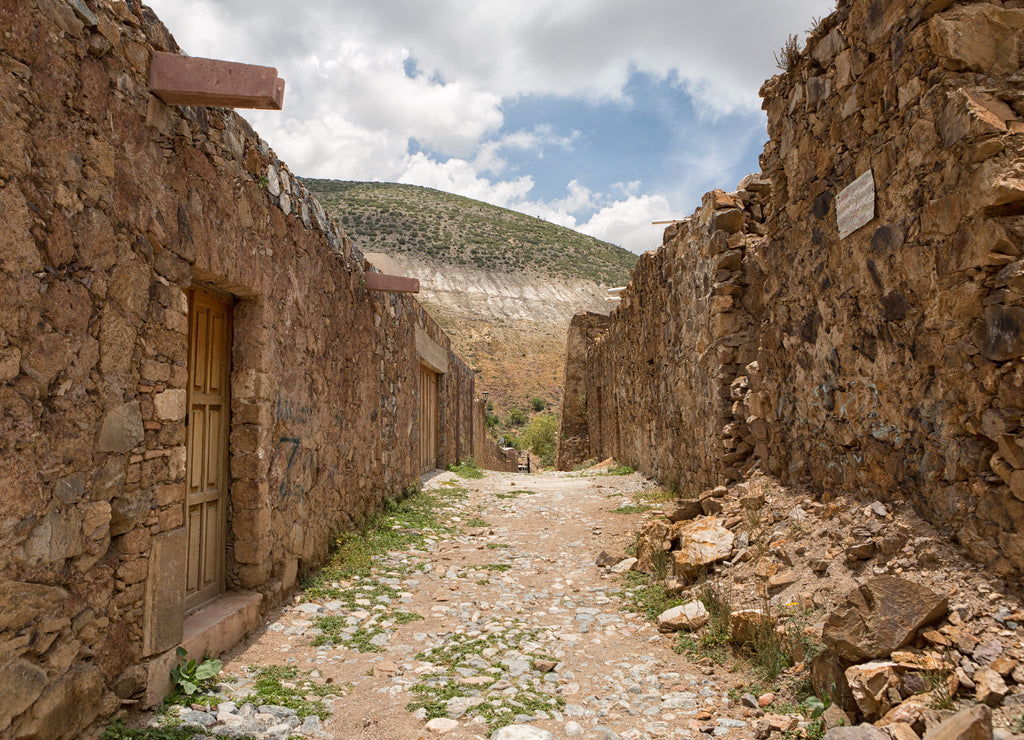 Stone houses along cobblestone streets are mostly abandoned and dilapidated in Real de Catorce, Mexico