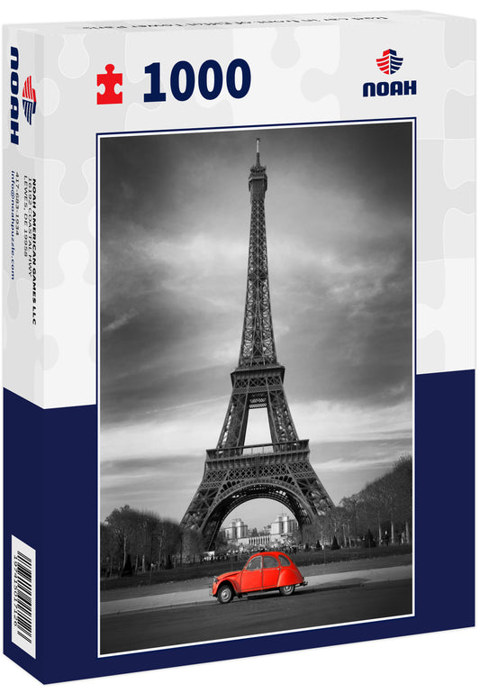 Red car in front of Eiffel Tower Paris