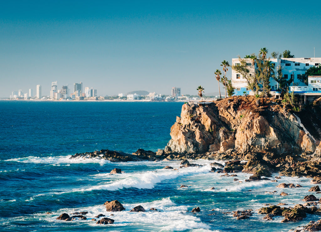 Mazatlan seen from a distance with a spectacular cliff in the foreground, Mexico
