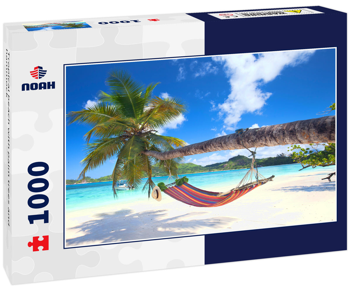 Tropical beach with palm trees and hammock