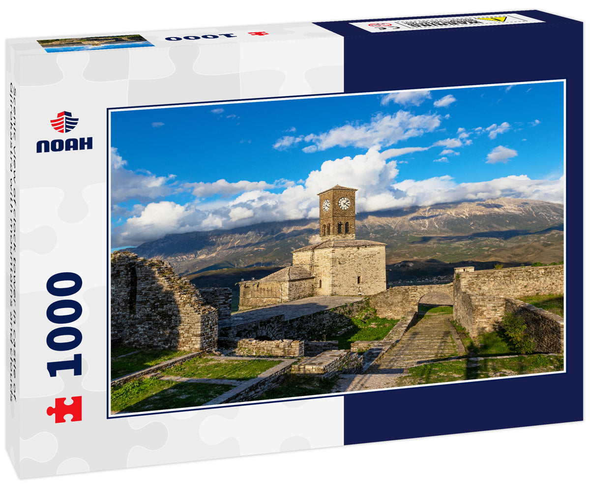 Scenic view of clock tower in castle of Gjirokastra with mountains and clouds