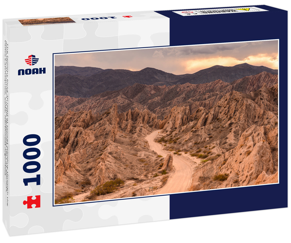 The famous Ruta 40 road at sunset winding through the geological wonders of the Quebrada de Las Flechas, Valles Calchaquíes, Salta, Northwest Argentina