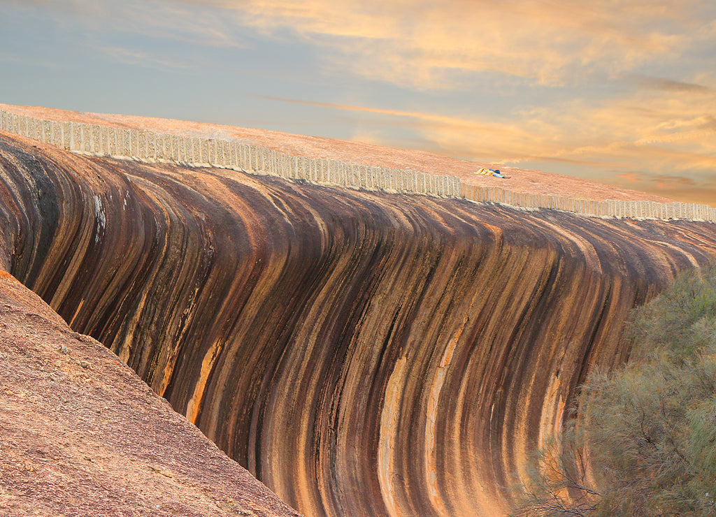 Huge rock formation (granite inselberg) shaped like a breaking wave (Wave Rock, Hyden, Western Australia)