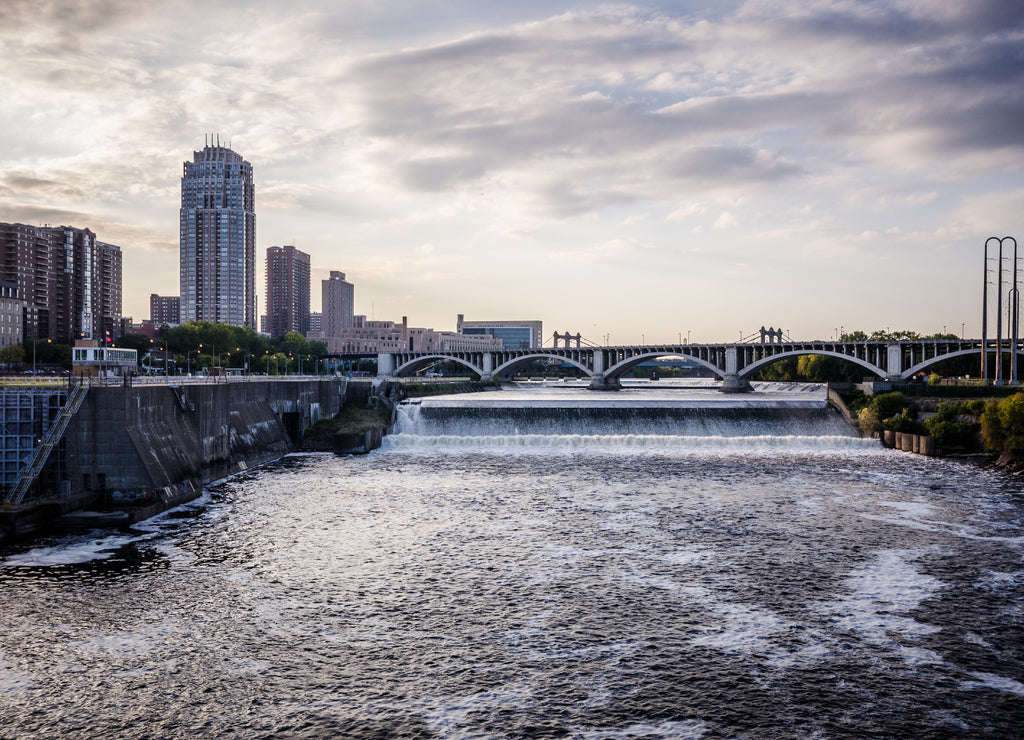 Sunset dusk view of Minneapolis Minnesota skyline as seen from the Mississippi River