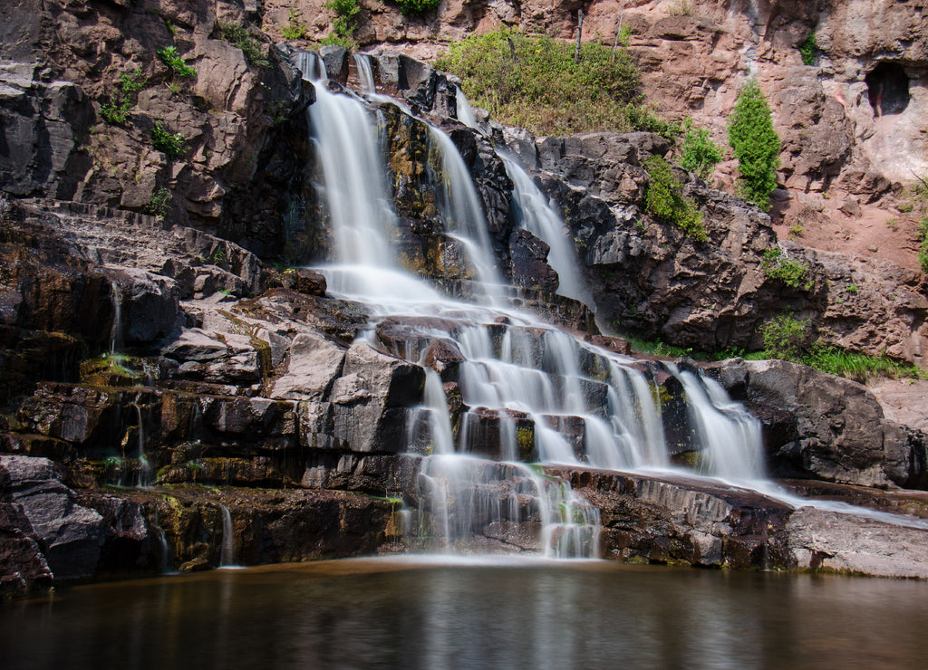 Daytime long exposure of Gooseberry Falls waterfalls at the state park in Minnesota in summer