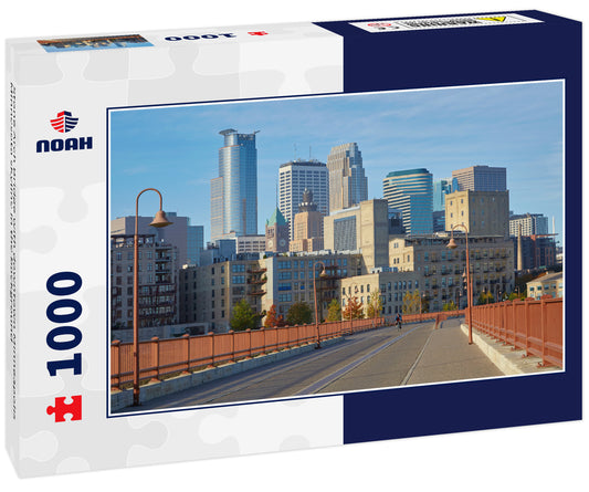 Stone Arch Bridge with downtown Minneapolis Minnesota skyline in the background