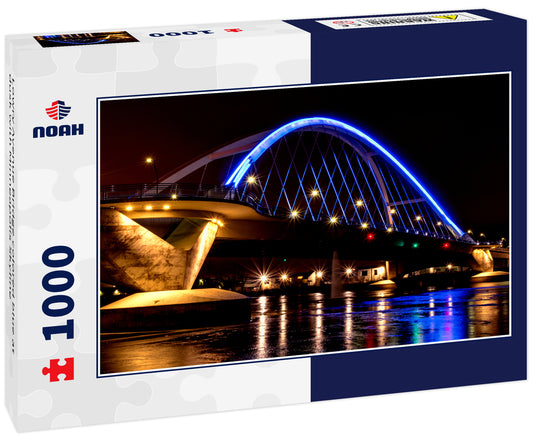 Lowry Avenue Bridge colored blue at dusk with Minneapolis Skyline