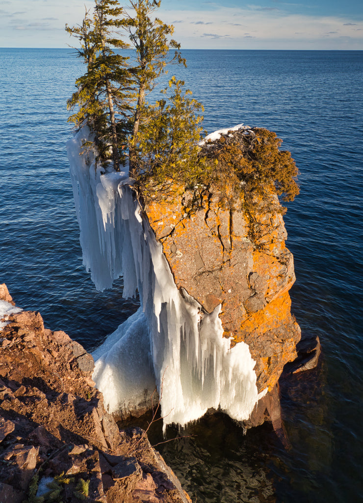 Cliff at Tettegouche State Park half-covered with ice, Lake Superior, Minnesota