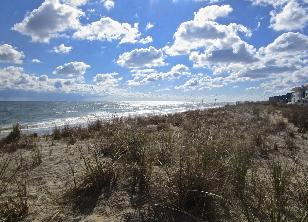 Bethany Beach, Delaware, USA: A long, low band of beautiful white clouds along the beach on the Atlantic Ocean