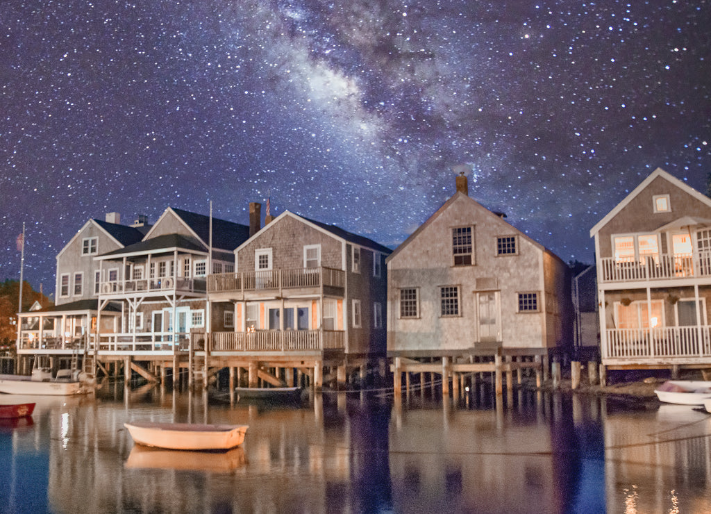 Beautiful homes of Nantucket at night, USA. Ocean reflections and starry night, Massachusetts