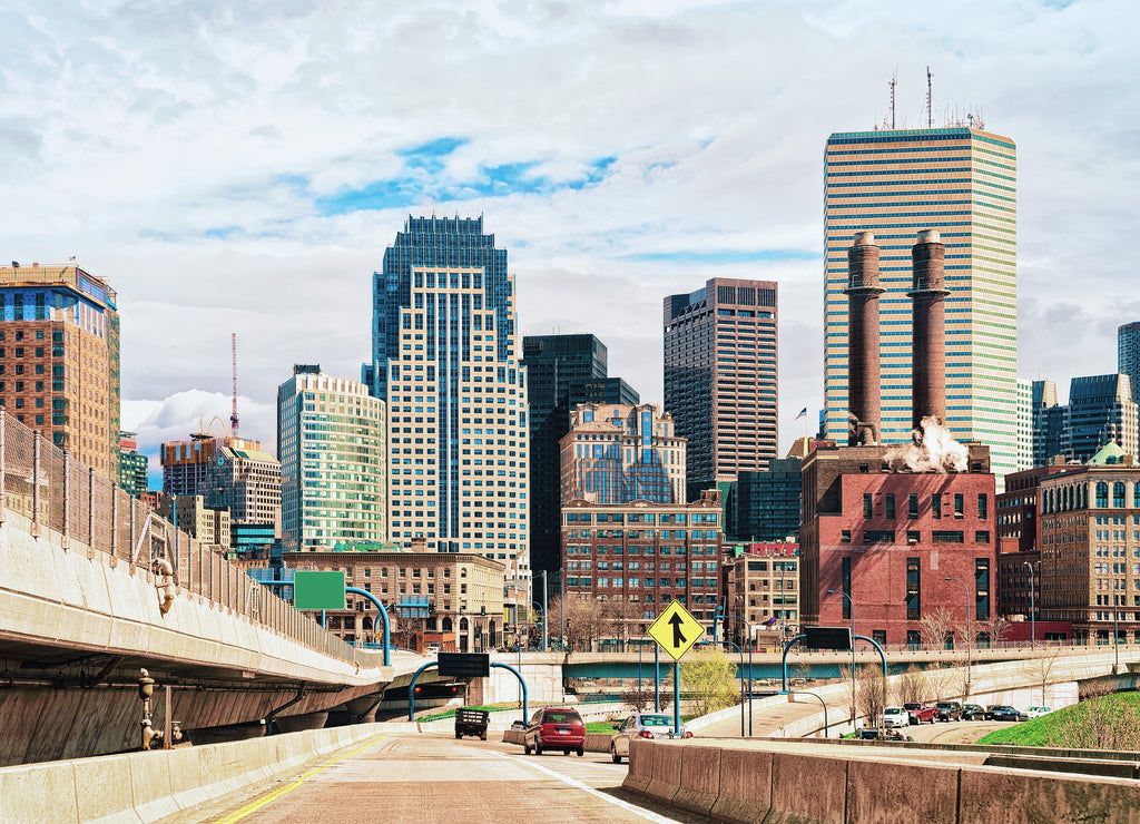 Skyline of skyscrapers and Boston road with car traffic