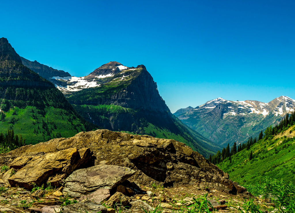 Mounts Oberlin, Cannon and Clements Mountain against a clear blue sky. Glacier National Park Montana