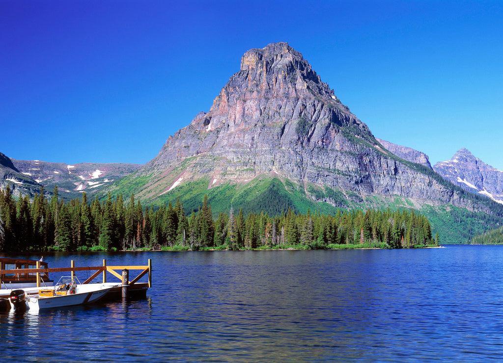 USA, Montana, Glacier NP. Tour boats cruise Upper Two Medicine Lake and deposit hikers near Mt. Sinopah in Glacier National Park, Montana