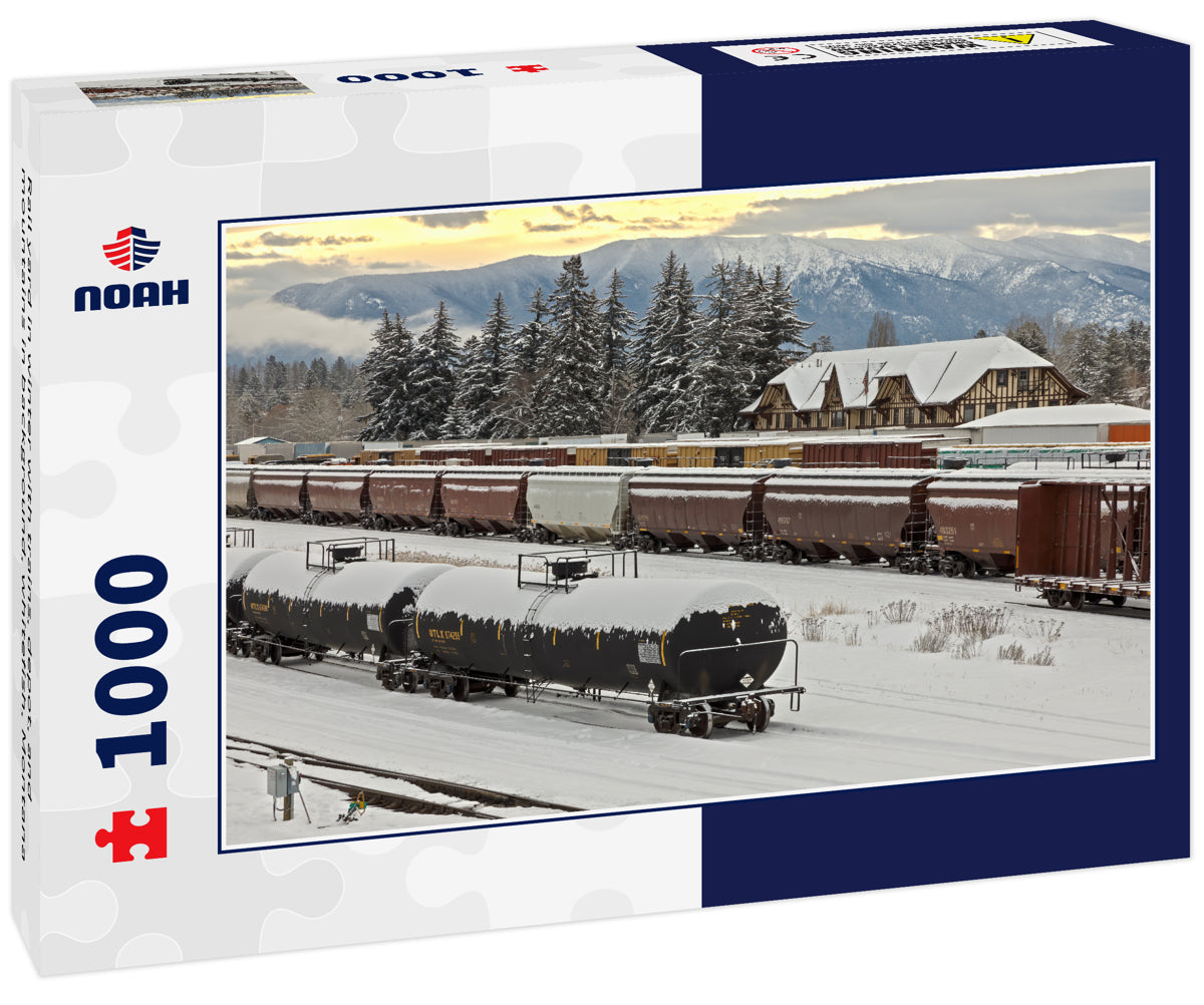 Rail yard in winter with trains, depot, and mountains in background, whitefish, Montana
