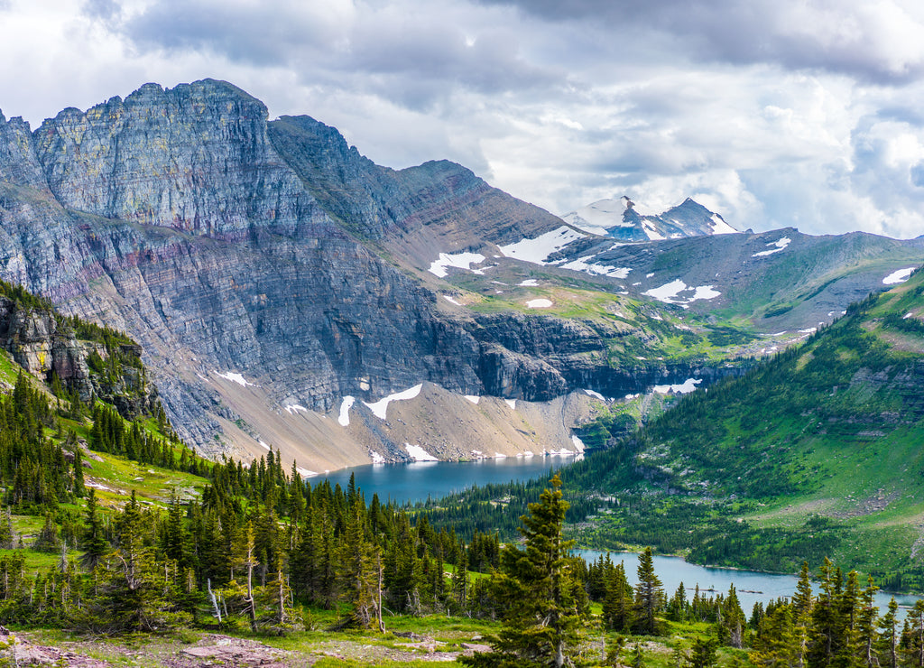 The hidden lake and mountains in Glacier National Park, in Montana, on a cloudy day.