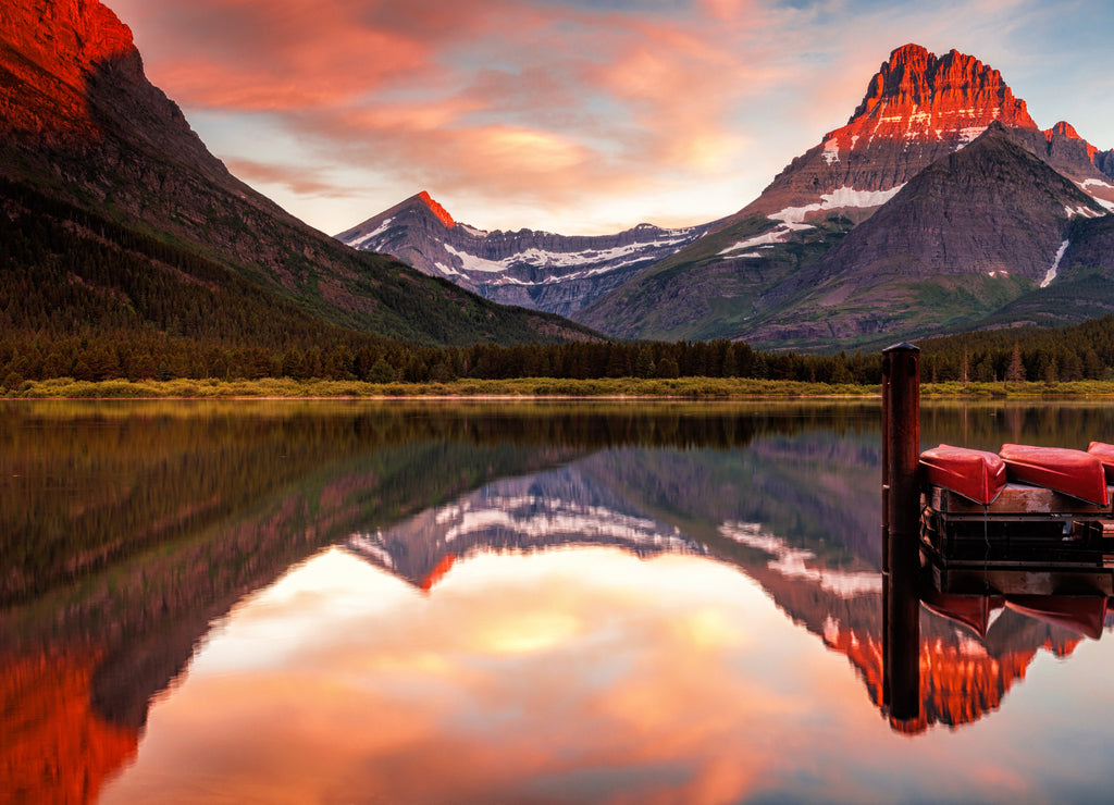 Alpenglow on Mount Grinnell at dawn seen at Many Glacier in Montana's Glacier National Park