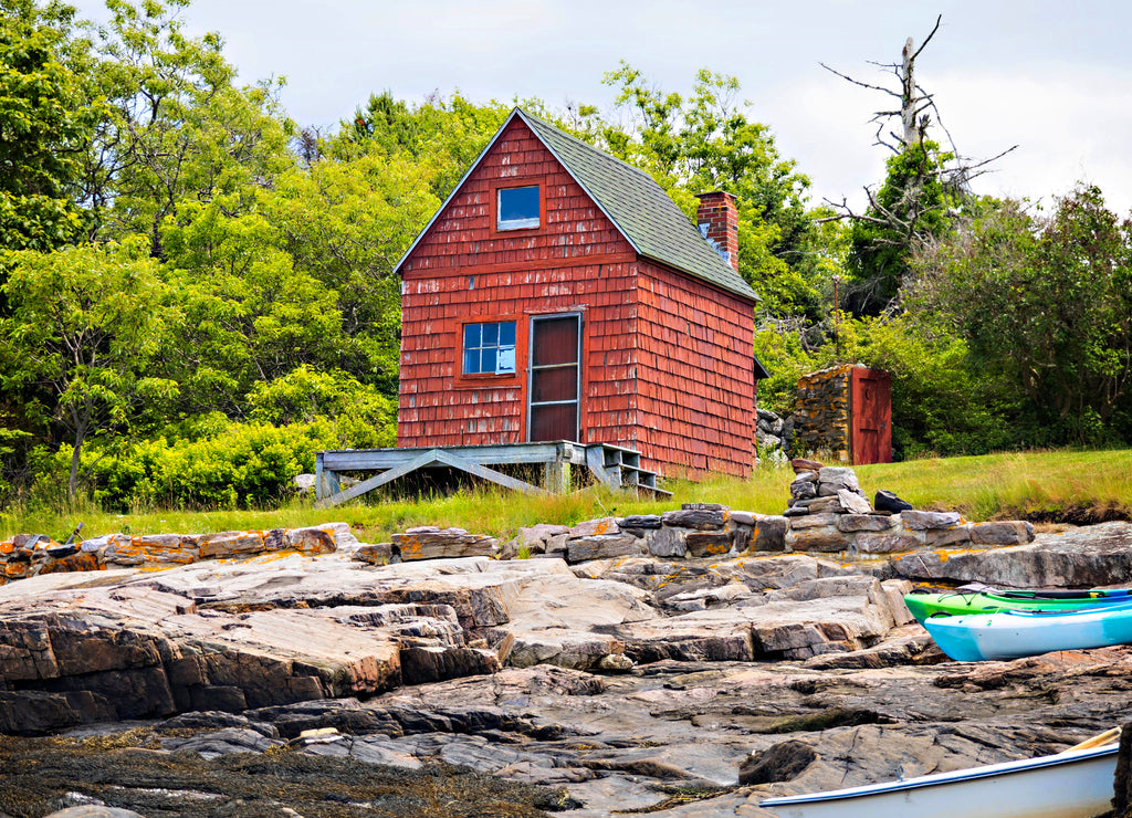 Old red cottage on the coast in Maine at Sagadahoc Bay