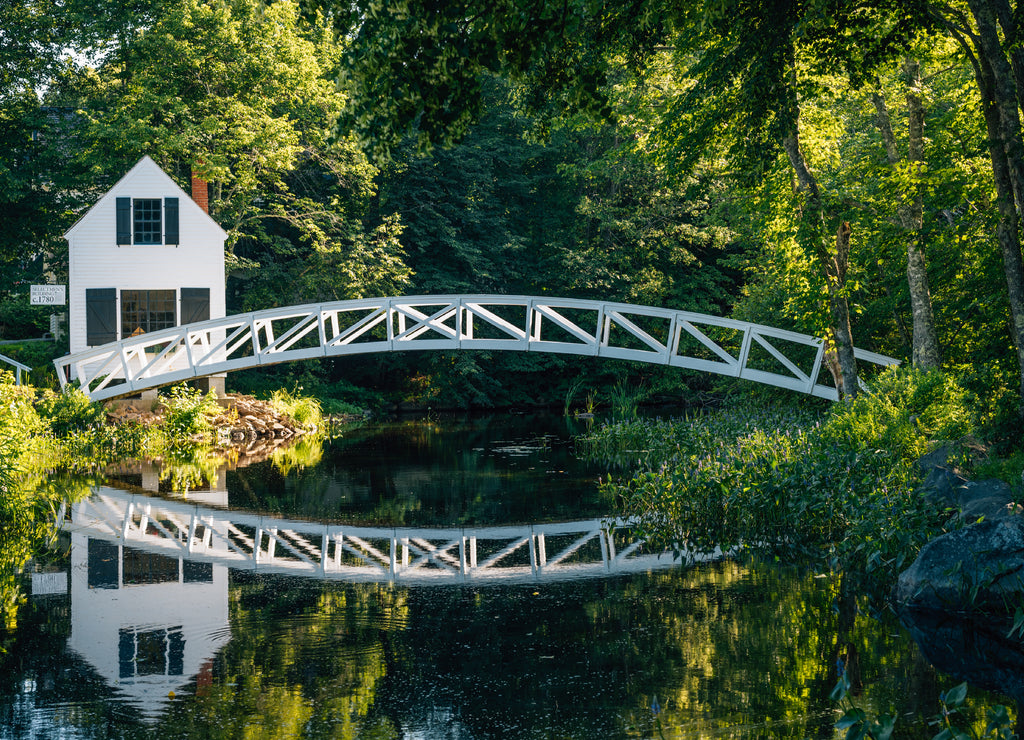 Bridge over a pond and the Selectmen's Building in Somesville, Maine