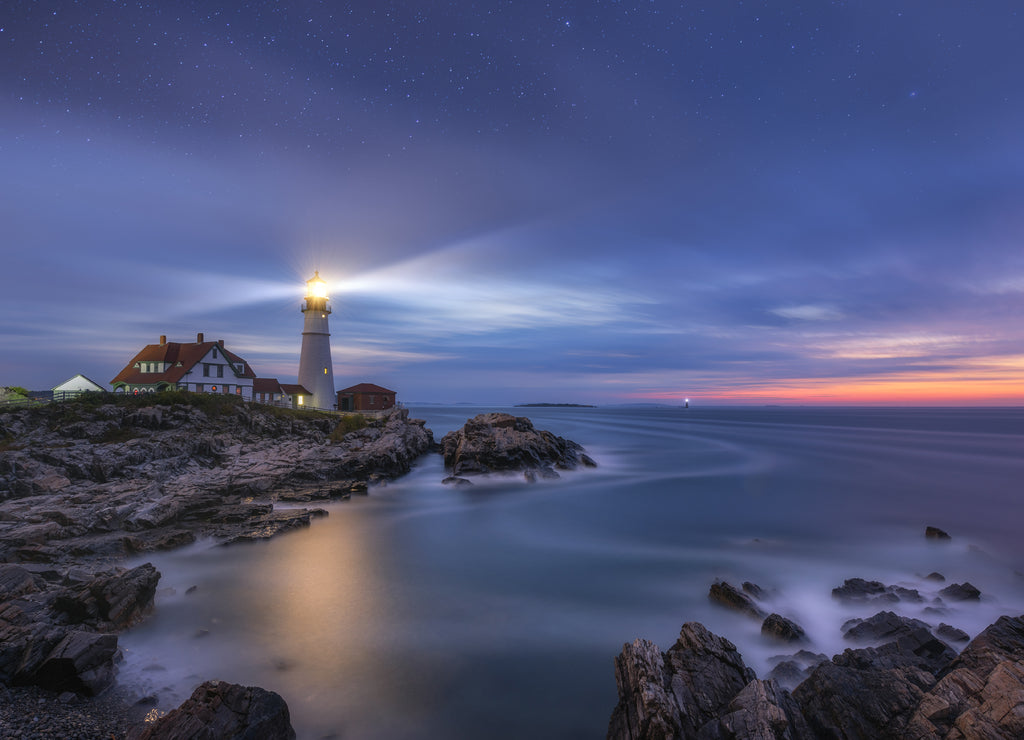 Night to day image of Portland Head Lighthouse at Cape Elizabeth, Maine