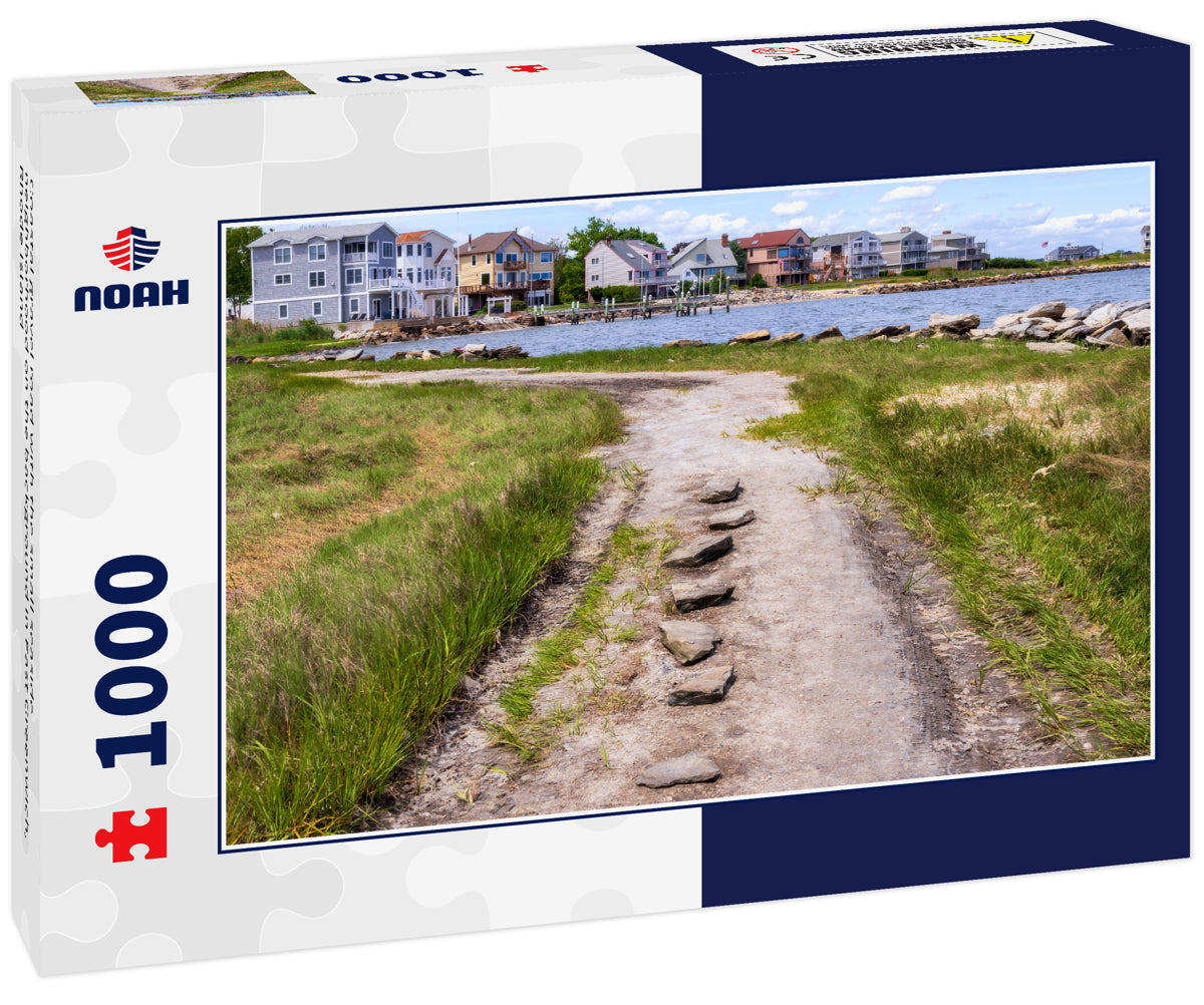 Coastal gravel road with the small seaside neighborhood on the background in East Greenwich, Rhode Island