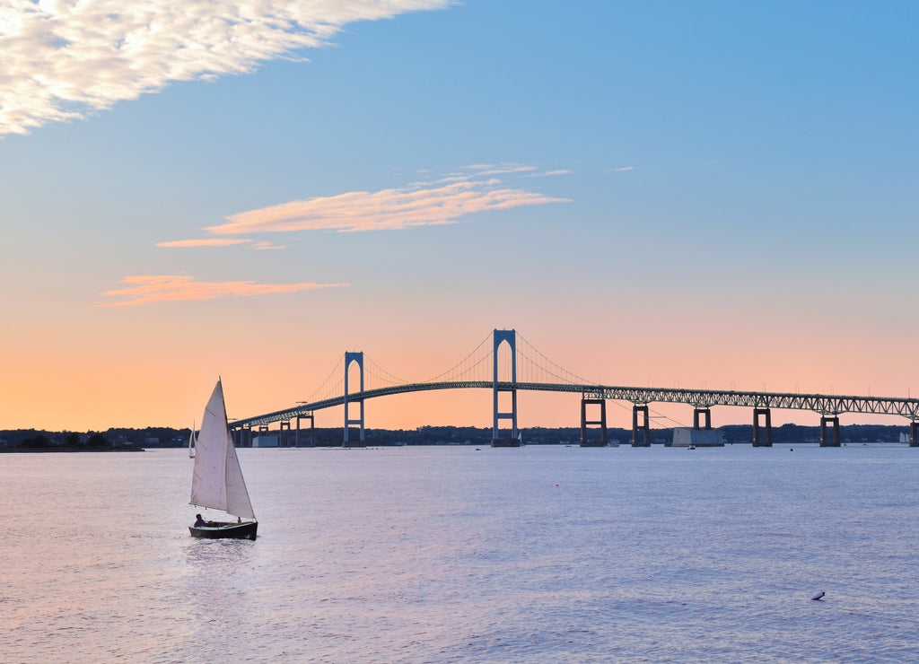 Newport Bridge twilight sunset with sailboats Rhode Island USA a popular New England holiday vacation destination