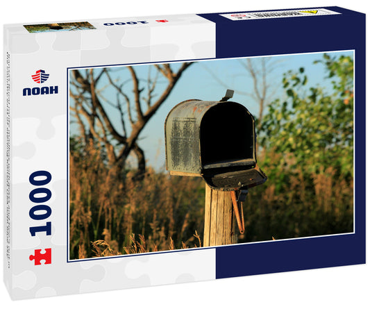 Kansas Rural route mailbox with grass and tree's out in the country east of Sterling Kansas USA with blue sky