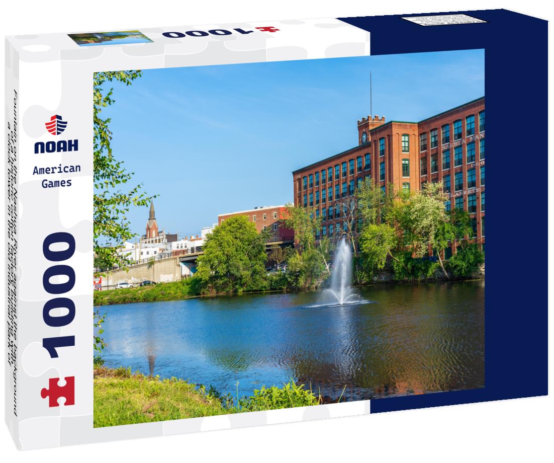 Noah Jigsaw Puzzle Fountain on the Nashua River against the background of a historic cotton factory building with a clock tower in the old industrial park of Nashua. New Hampshire, USA 1000 pieces
