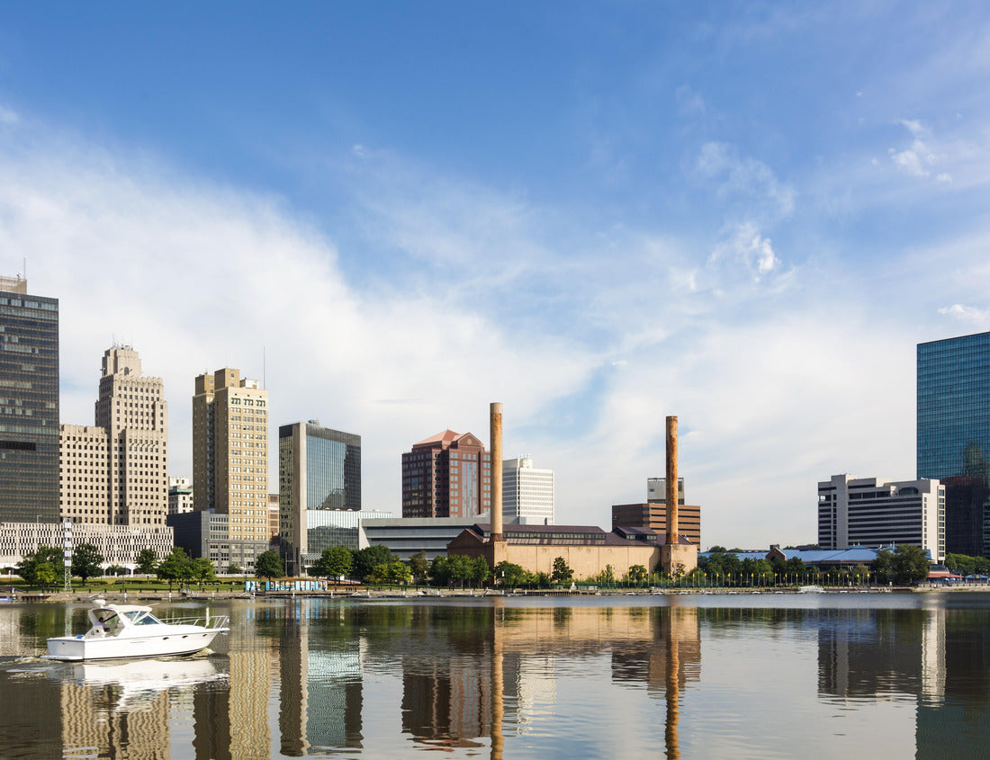 Noah Jigsaw Puzzle A panoramic view of downtown Toledo Ohio's skyline reflecting into the Maumee river with a power boat cruising by. A beautiful blue sky with white clouds for a backdrop 1000 pieces