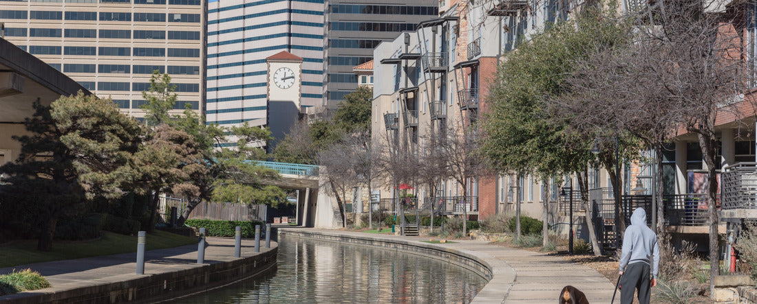 Back view of man in hoody walking dog along Mandalay Canal in Irving, Texas, USA 2000pc Panoramic Puzzle