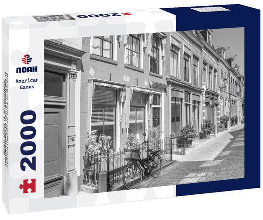 Noah Jigsaw Puzzle Bicycle in front of colorful houses in the historic city of Leeuwarden, Netherlands in black white 2000 pieces