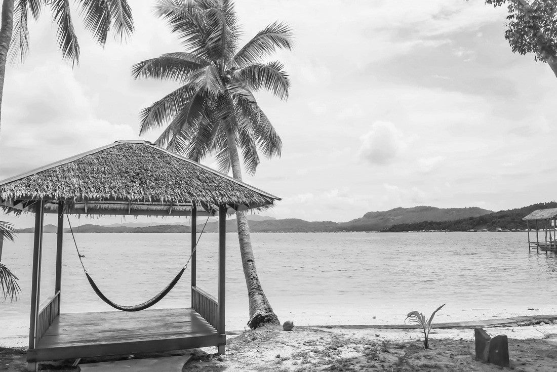 Tropical summer beach resort with palm, coconut trees, and hammock in Piugus Island, Anambas, Indonesia on a beautiful summer day with colorful ocean waters, pristine sands and cloudy sky. Copy space 2000pc PuzzleBlack and White
