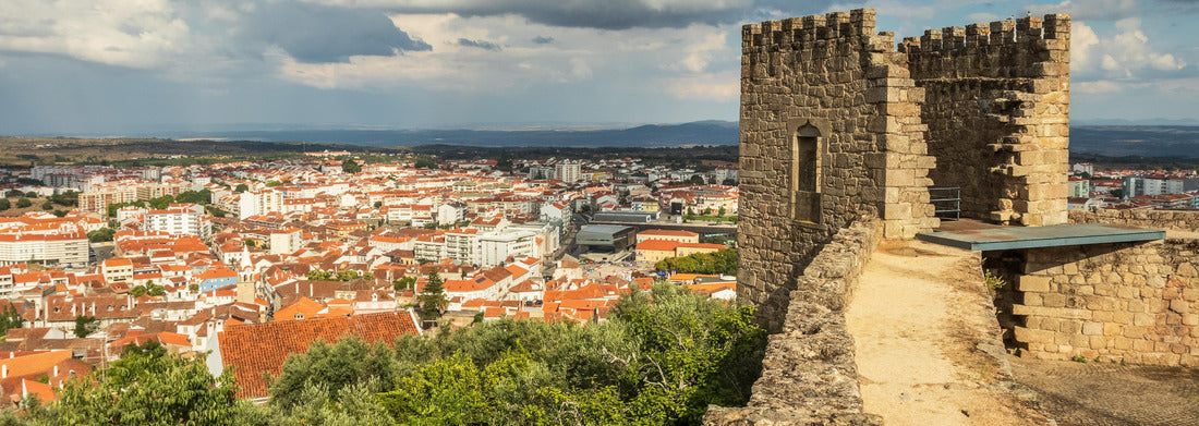 Noah Jigsaw Puzzle Castle tower of Castelo Branco, Portugal, with the city in the background and a sky with big clouds, panorama Panorama 1000 Pieces