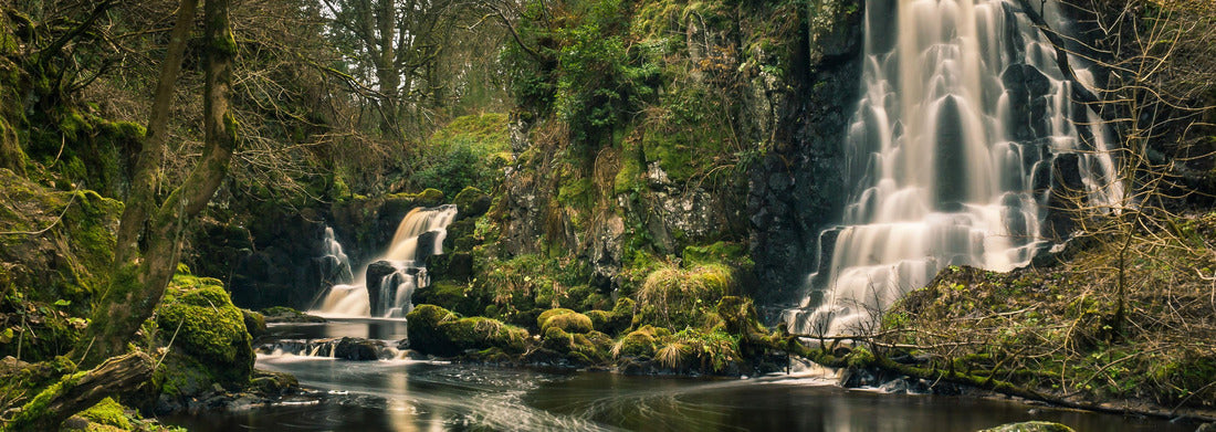 Noah Jigsaw Puzzle Long exposure shot of the Linn Jaw waterfalls, near Livingston, Scotland, with mossy rocks in the foreground and around the falls and white streaks of foam in the water. West Lothian. UK, panorama Panorama 1000 Pieces