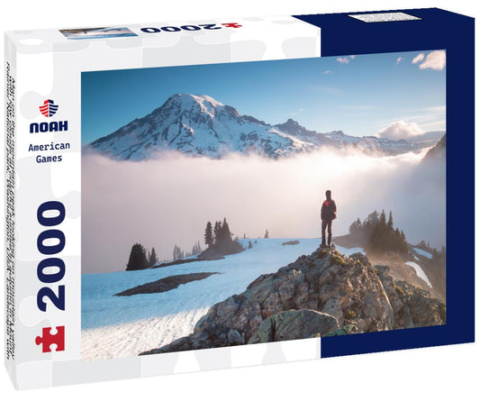Noah Jigsaw Puzzle Man on the mountain peak looking on mountain valley with low clouds at colorful sunrise in autumn in Mount Rainier National park, Washington, USA 2000 pieces
