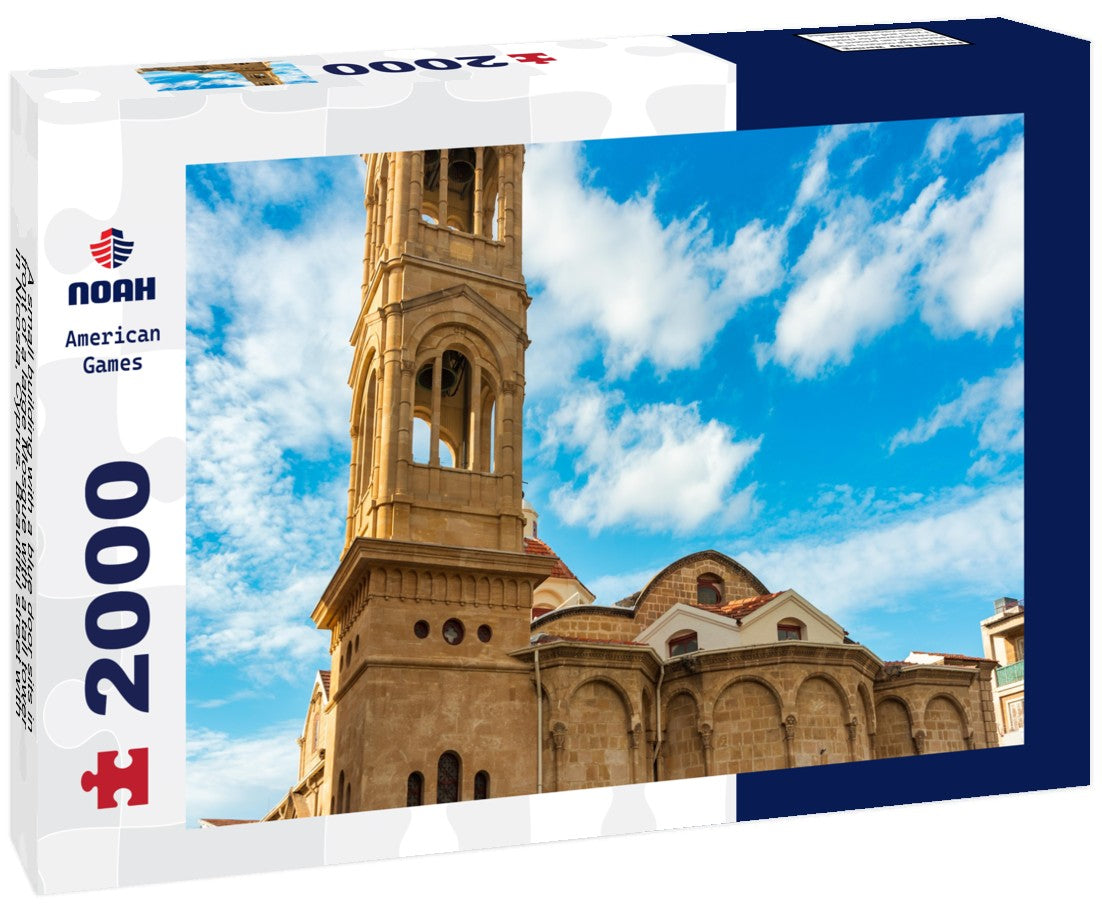 Noah Jigsaw Puzzle A small building with a blue door sits in front of a large Mosque with a tall tower in Nicosia, Cyprus. Beautiful street with old architecture in Nicosia, Cyprus 2000 pieces