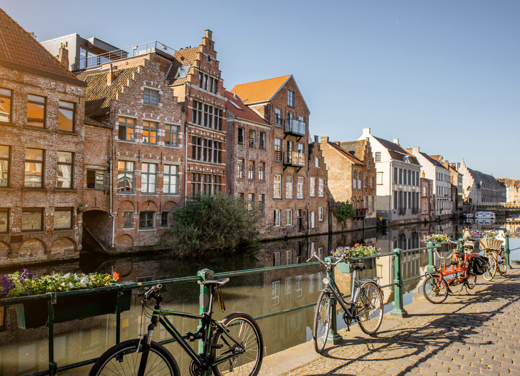 Riverside view with beautiful old buildings and bicycles during the morning light in Gent city, Belgium