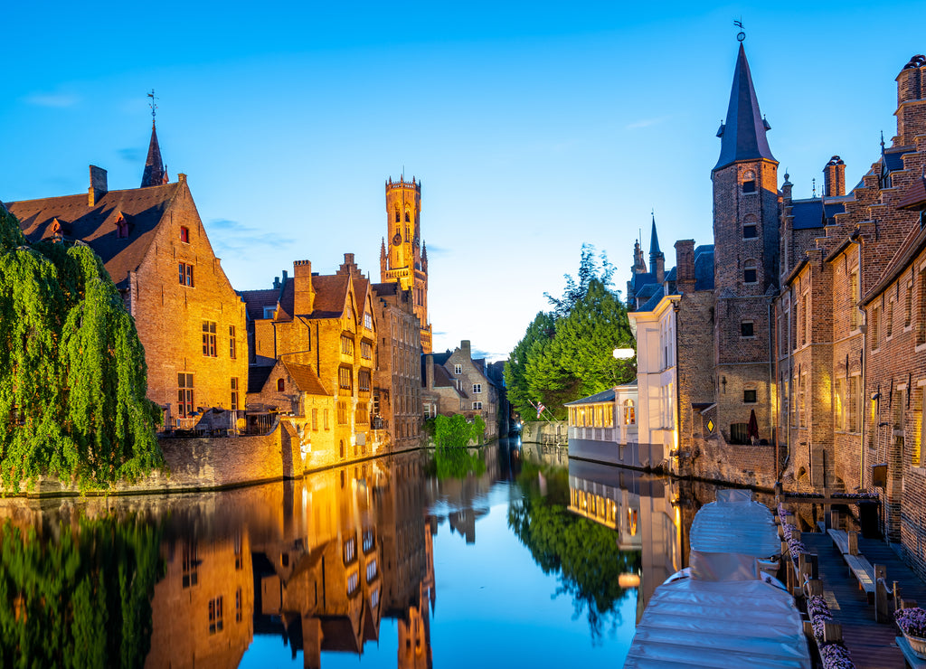 Bruges city skyline with canal at night in Belgium