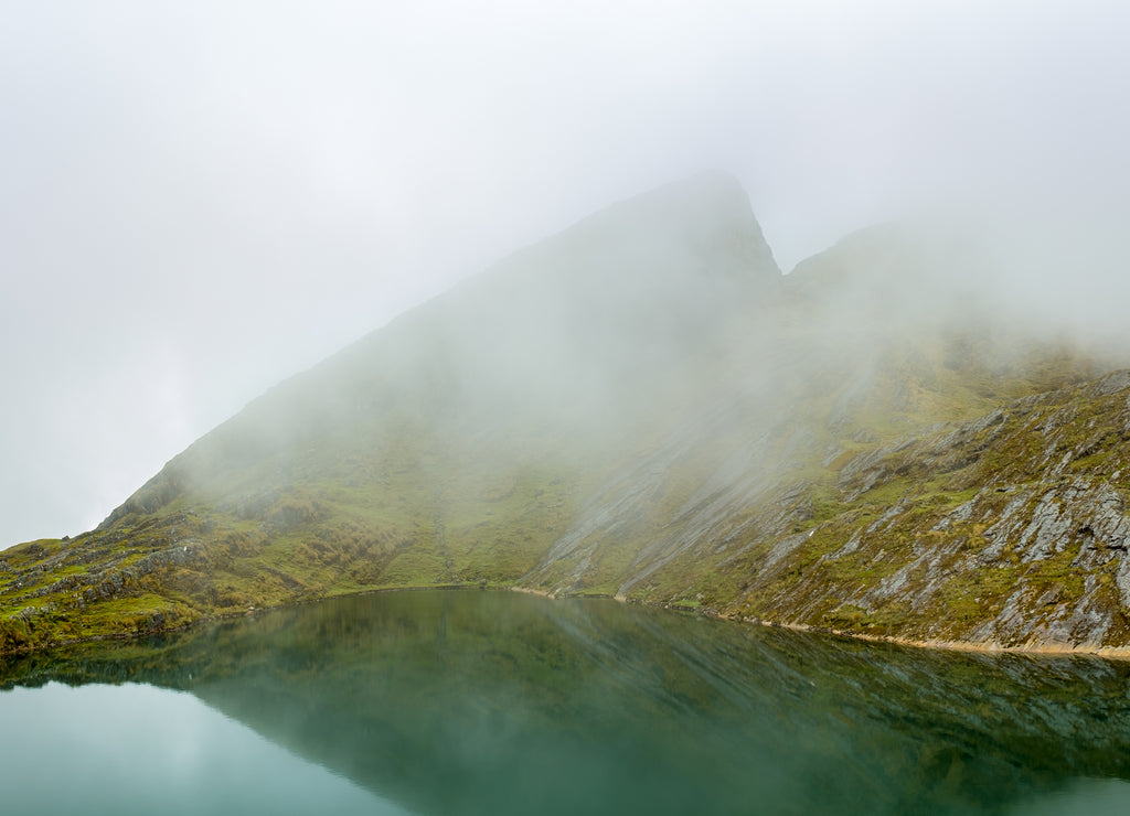 Beautiful Rock Mountain Covered of Green Moss by the Chillata Lagoon with Lot of Surrounded by Mist near Sorata, La Paz / Bolivia