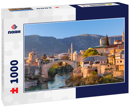 Skyline of Mostar with the Mostar Bridge, houses and minarets, at the sunset in Bosnia and Herzegovina