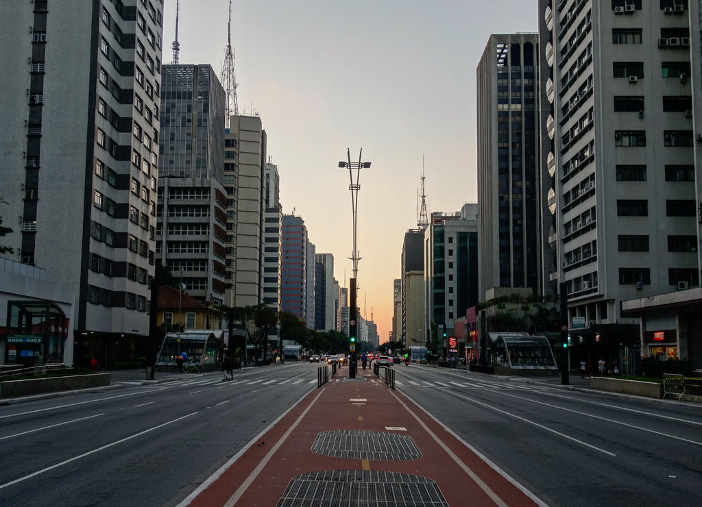 Paulista avenue in Sao Paulo city, at sunset. buildings and traffic in the financial center