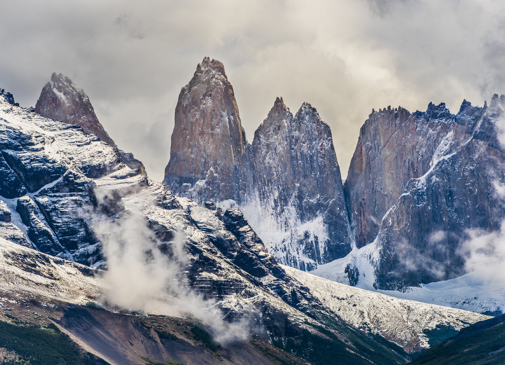 Torres del Paine peaks coming from clouds