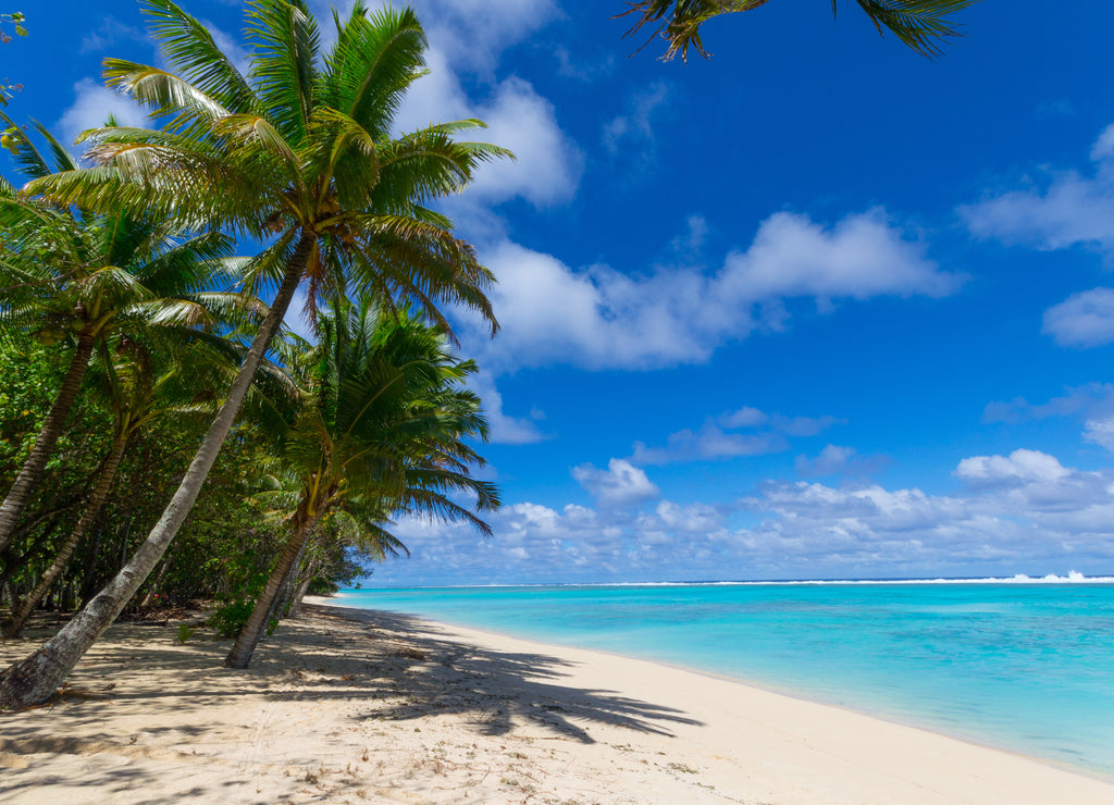 White beach on desert island in Rarotonga, Cook Islands