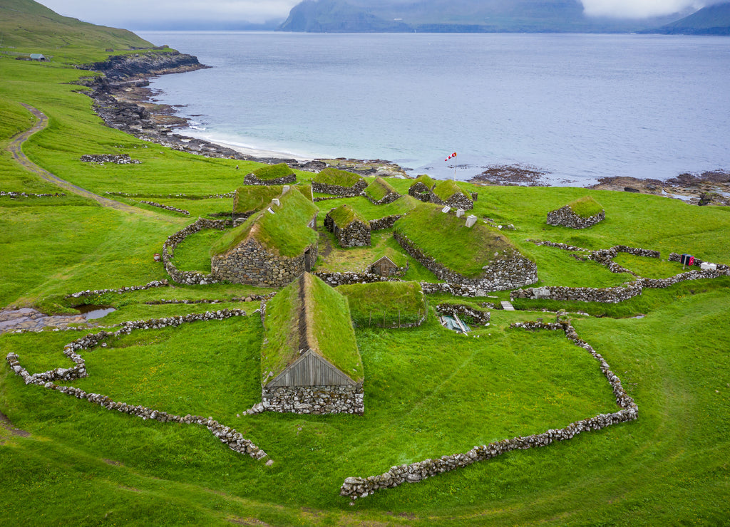 Aerial view of fishing village in Koltur island. Faroe Islands. Green roof houses