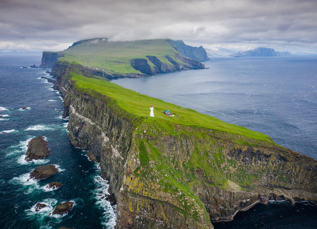 Aerial view of lighthouse at Mykines island in Faroe Islands, North Atlantic Ocean