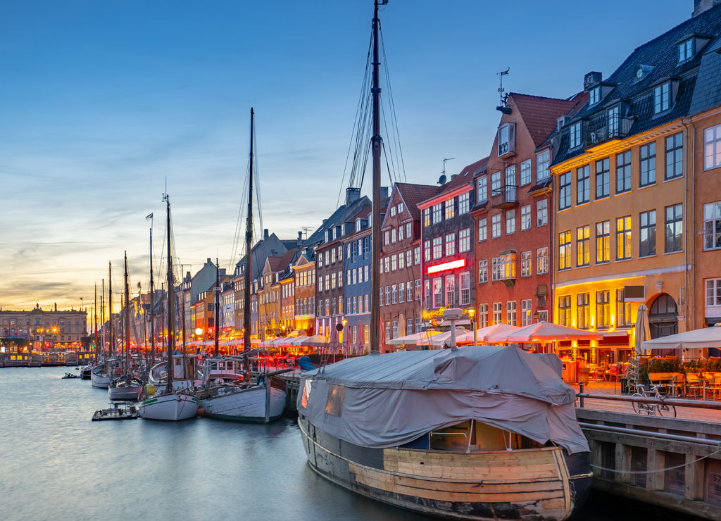 Nyhavn landmark buildings at night in Copenhagen city, Denmark