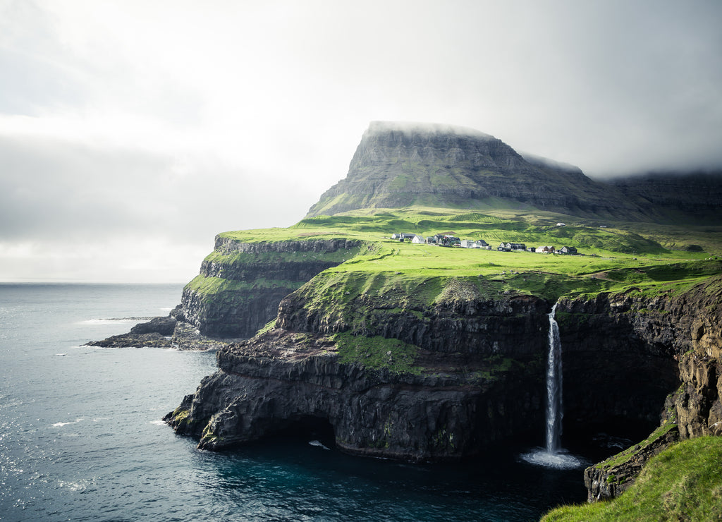 Gasadalur village and Beautiful waterfall. Vagar, Faroe Islands, Denmark